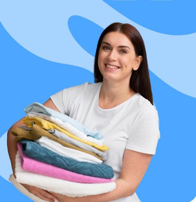 A happy customer holding freshly cleaned laundry