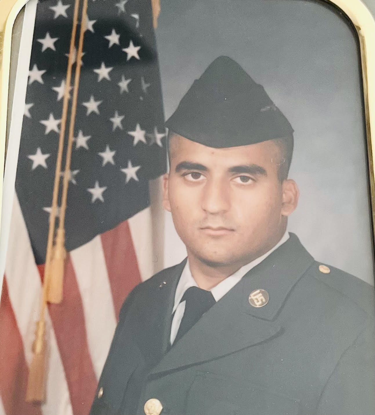Photograph of the Oxford Cleaners owner, a U.S. Army Reserves veteran.